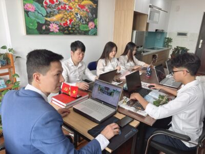 Dr. Son and the professional VTH Travel team planning personalized bespoke Vietnam tours for American travelers.